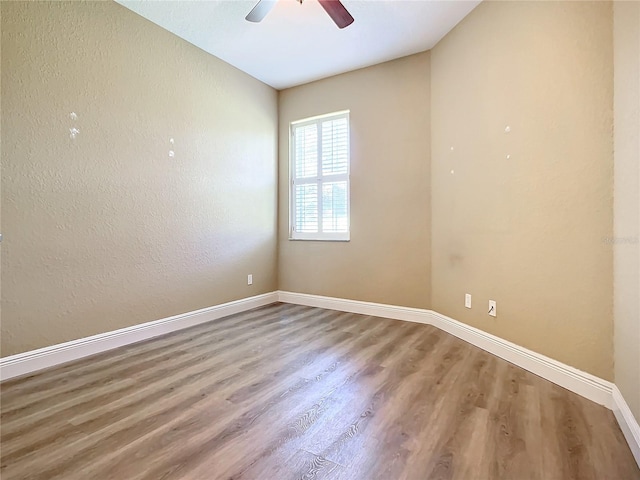 unfurnished room featuring wood-type flooring and ceiling fan