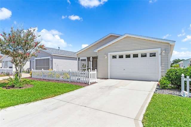 ranch-style home with a front yard and a garage