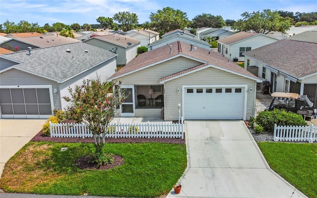 view of front of property with a garage and a front lawn