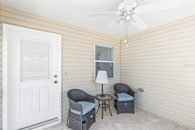 doorway to property featuring ceiling fan