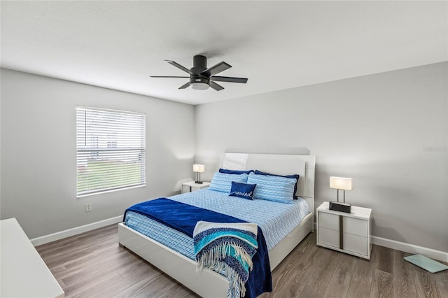 bedroom featuring hardwood / wood-style flooring and ceiling fan