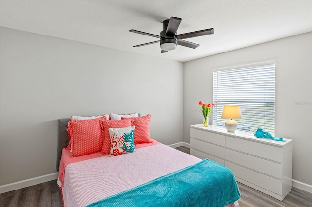 bedroom featuring ceiling fan and hardwood / wood-style floors