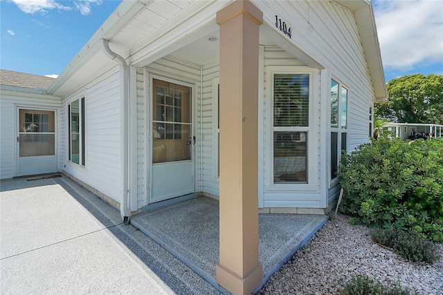 property entrance featuring a patio area