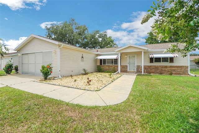 single story home featuring a garage and a front yard