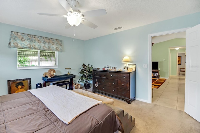 bedroom with ceiling fan and light colored carpet