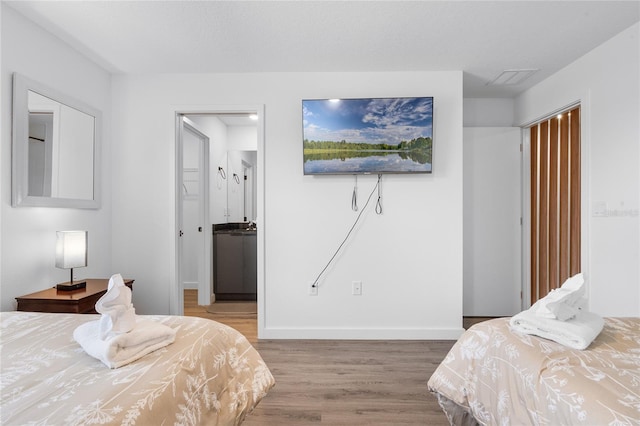 bedroom with light wood-type flooring