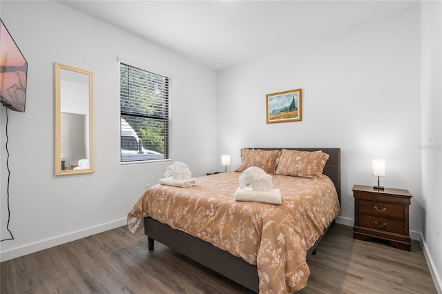 bedroom with wood-type flooring