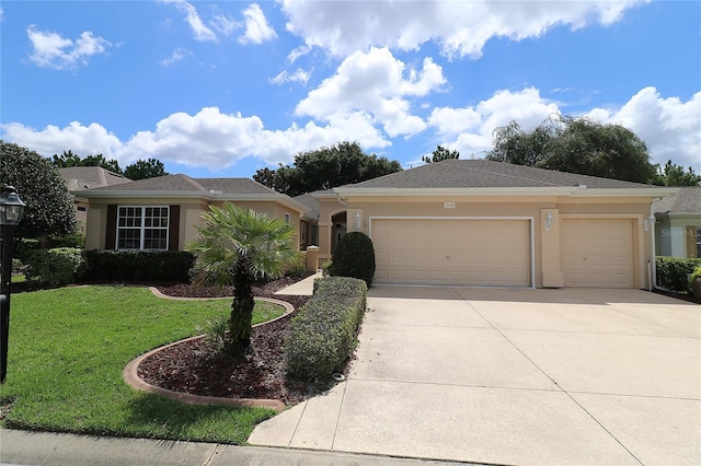 single story home featuring a front lawn and a garage