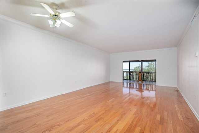 unfurnished room with crown molding, light hardwood / wood-style floors, and ceiling fan