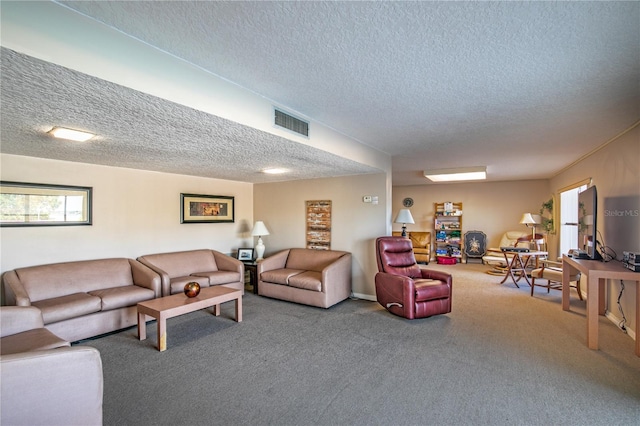 carpeted living room featuring a textured ceiling