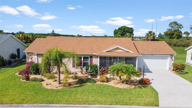 ranch-style house featuring a garage, a front yard, and central AC