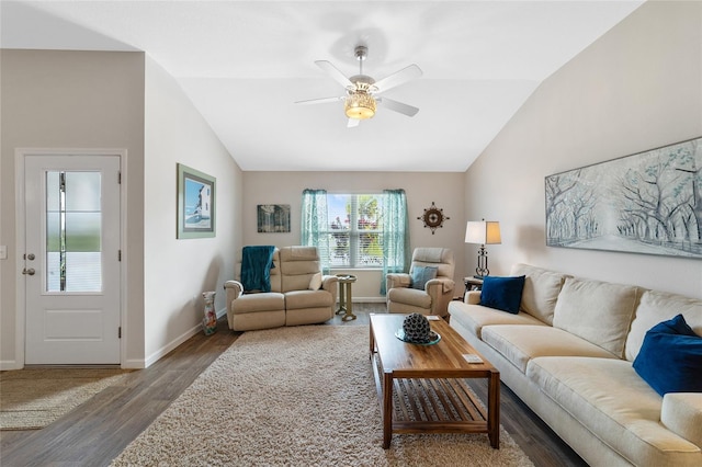 living room featuring lofted ceiling, ceiling fan, and dark wood-type flooring