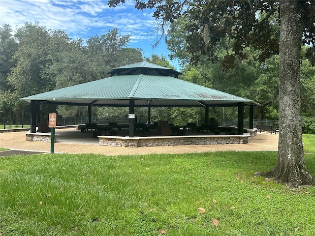 view of property's community with a gazebo and a lawn