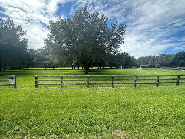 view of yard with a rural view