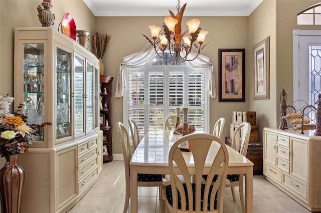 dining area featuring ornamental molding, light tile patterned flooring, and a chandelier