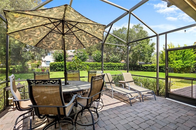 view of patio with glass enclosure