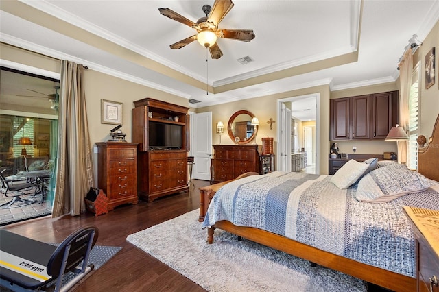 bedroom with dark hardwood / wood-style flooring, access to exterior, ceiling fan, a tray ceiling, and crown molding