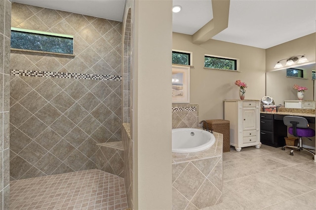 bathroom with tile patterned floors, vanity, and independent shower and bath