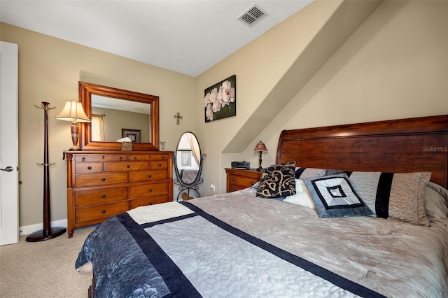 bedroom with light colored carpet