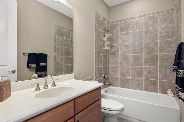 full bathroom with vanity, toilet, and tiled shower / bath