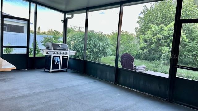 unfurnished sunroom featuring plenty of natural light