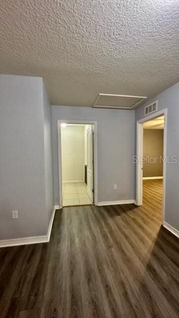 interior space featuring hardwood / wood-style floors and a textured ceiling