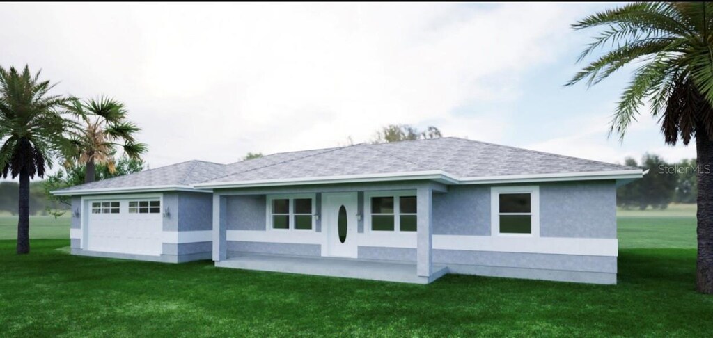 rear view of house featuring a patio and a yard