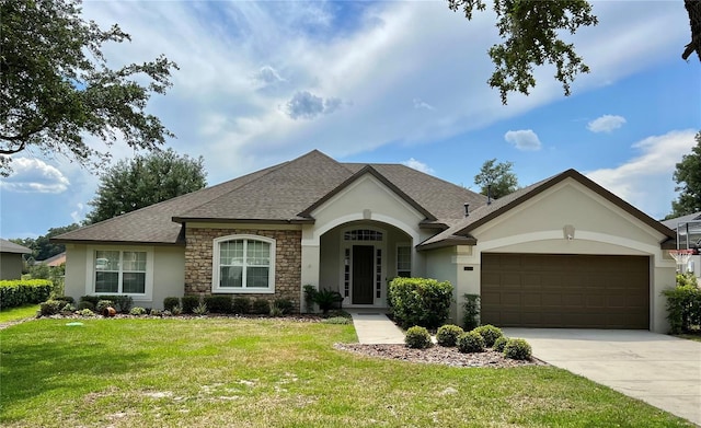 ranch-style house with a garage and a front lawn