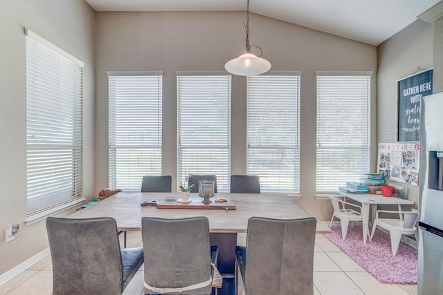 32313 Oak Canopy Dr, Sorrento, FL 32776 - dining space featuring light tile patterned flooring, baseboards, and lofted ceiling