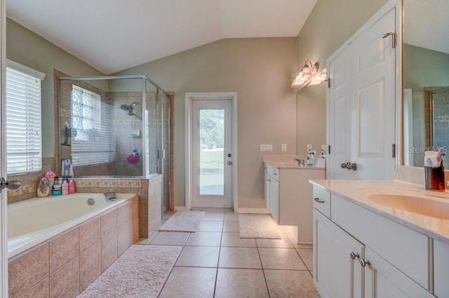 32313 Oak Canopy Dr, Sorrento, FL 32776 - full bathroom featuring a garden tub, lofted ceiling, two vanities, a stall shower, and tile patterned floors