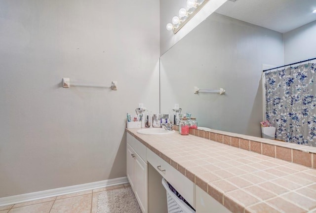 32313 Oak Canopy Dr, Sorrento, FL 32776 - full bathroom featuring tile patterned floors, baseboards, a shower with curtain, and vanity