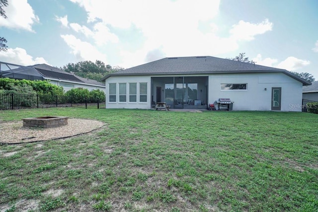 32313 Oak Canopy Dr, Sorrento, FL 32776 - rear view of property featuring stucco siding, fence, a lawn, and a sunroom