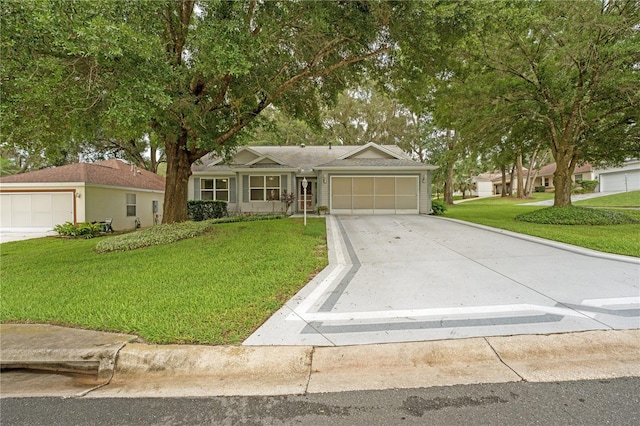 ranch-style home featuring a front lawn and a garage