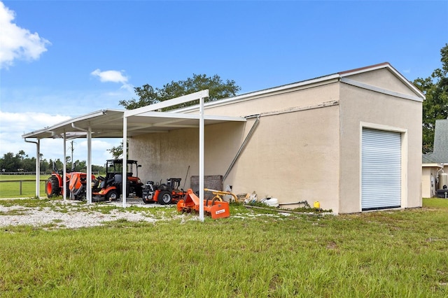 view of outbuilding featuring a lawn