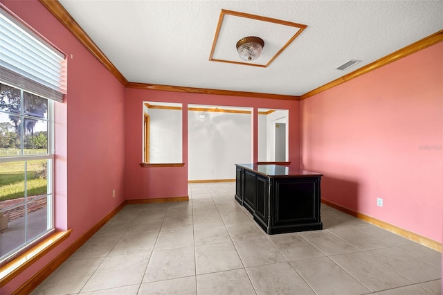 interior space featuring ornamental molding and a textured ceiling