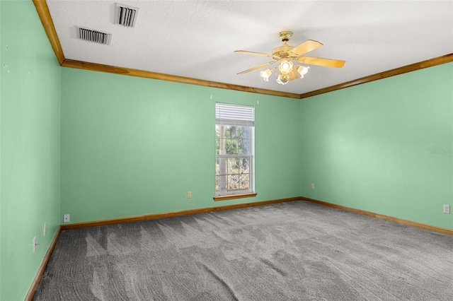 carpeted empty room featuring crown molding, a textured ceiling, and ceiling fan