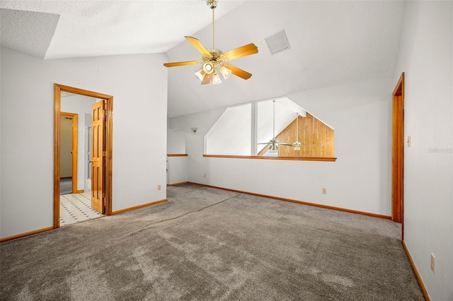 bonus room featuring ceiling fan, vaulted ceiling, light colored carpet, and a textured ceiling