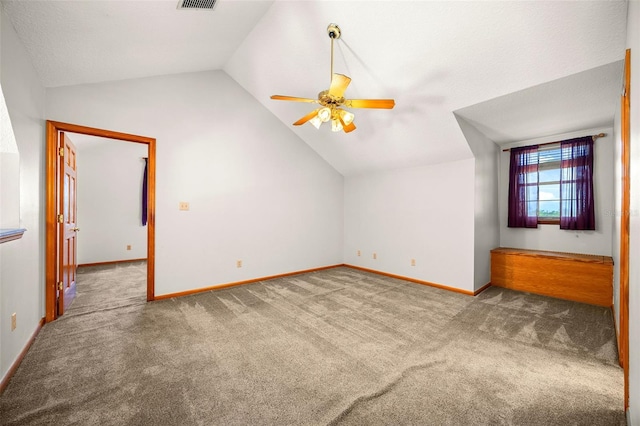 bonus room with carpet floors, vaulted ceiling, and ceiling fan