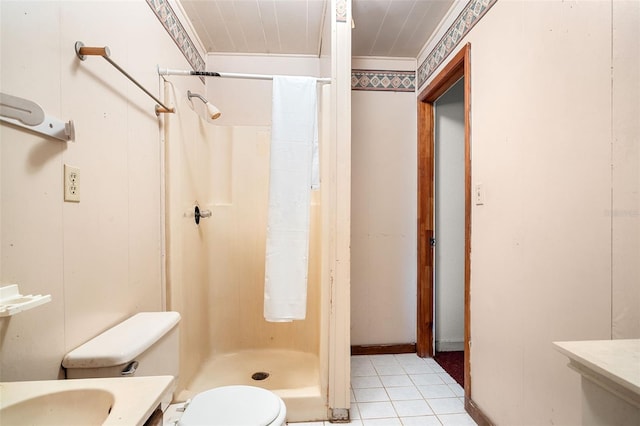 bathroom with walk in shower, tile patterned floors, vanity, and toilet