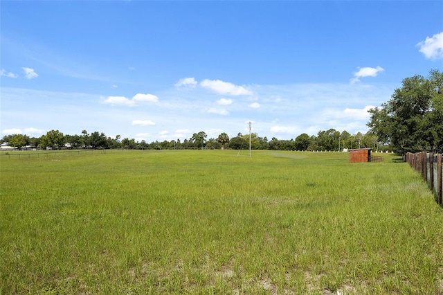 view of yard with a rural view