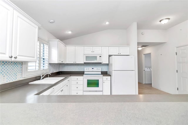 kitchen with white appliances, decorative backsplash, lofted ceiling, white cabinetry, and sink