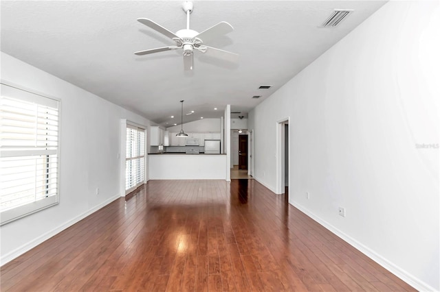 unfurnished living room with ceiling fan, lofted ceiling, and hardwood / wood-style flooring