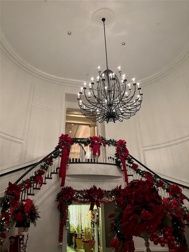 details featuring a notable chandelier and crown molding