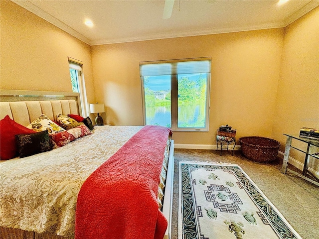 carpeted bedroom with ceiling fan, ornamental molding, and multiple windows