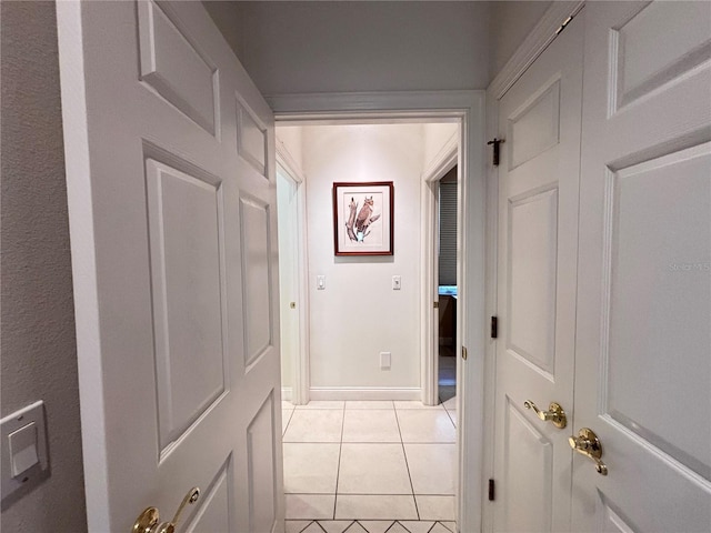 corridor with light tile patterned flooring