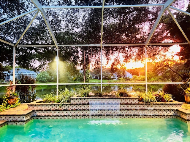 view of pool with a lanai