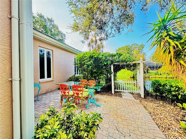 view of patio / terrace featuring outdoor dining area and fence