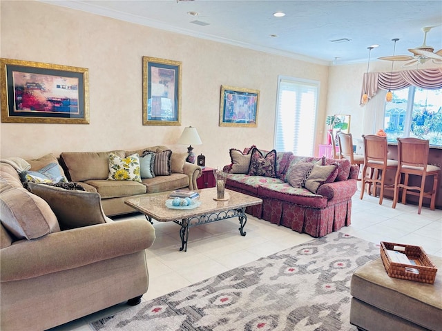 tiled living room featuring plenty of natural light and ornamental molding