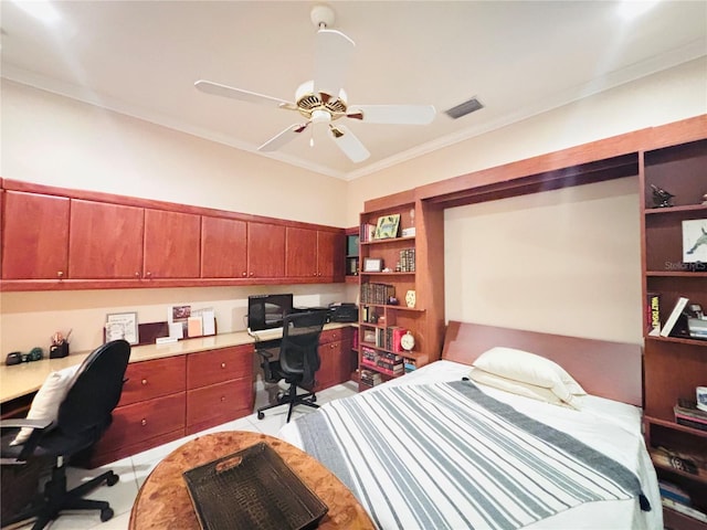 office featuring ceiling fan, crown molding, and built in desk