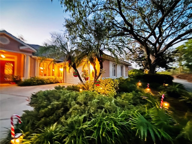 view of property exterior at dusk